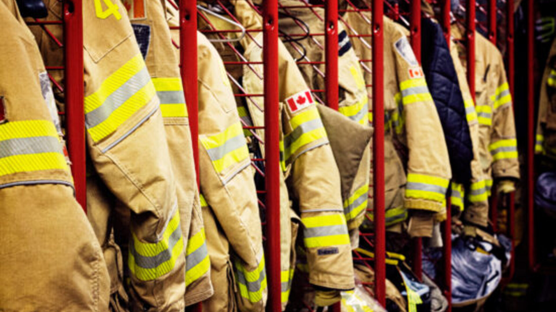 Canadian fire department turnout gear on the rack
